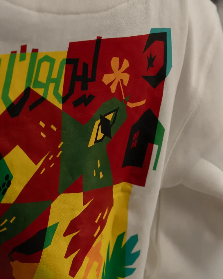 The Return Hoodie by Naji Al-Ali LMNBCK — premium cotton hoodie with bold colourful LMNBCK graphic illustration