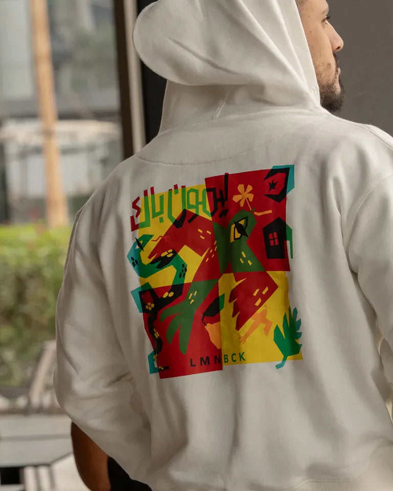 The Return Hoodie by Naji Al-Ali LMNBCK — premium cotton hoodie with bold colourful LMNBCK graphic illustration