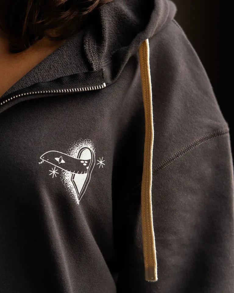 Snake Eyes Hoodie by Naji Al-Ali LMNBCK — black premium cotton hoodie with monochrome LMNBCK graphic illustration