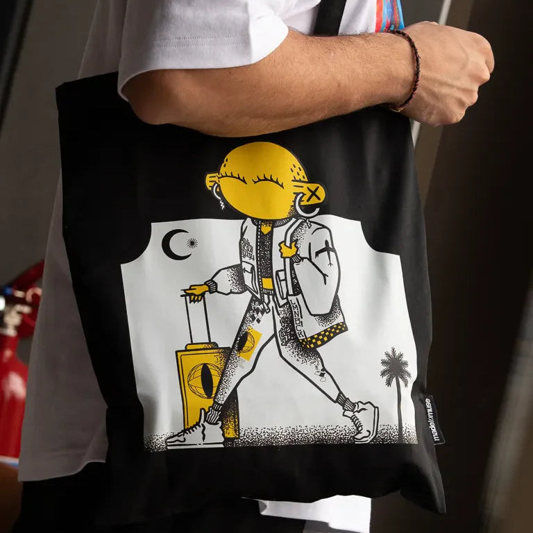 Laymona Travel Tote Bag by Naji Al-Ali LMNBCK — black canvas tote with bold illustrated LMNBCK character design
