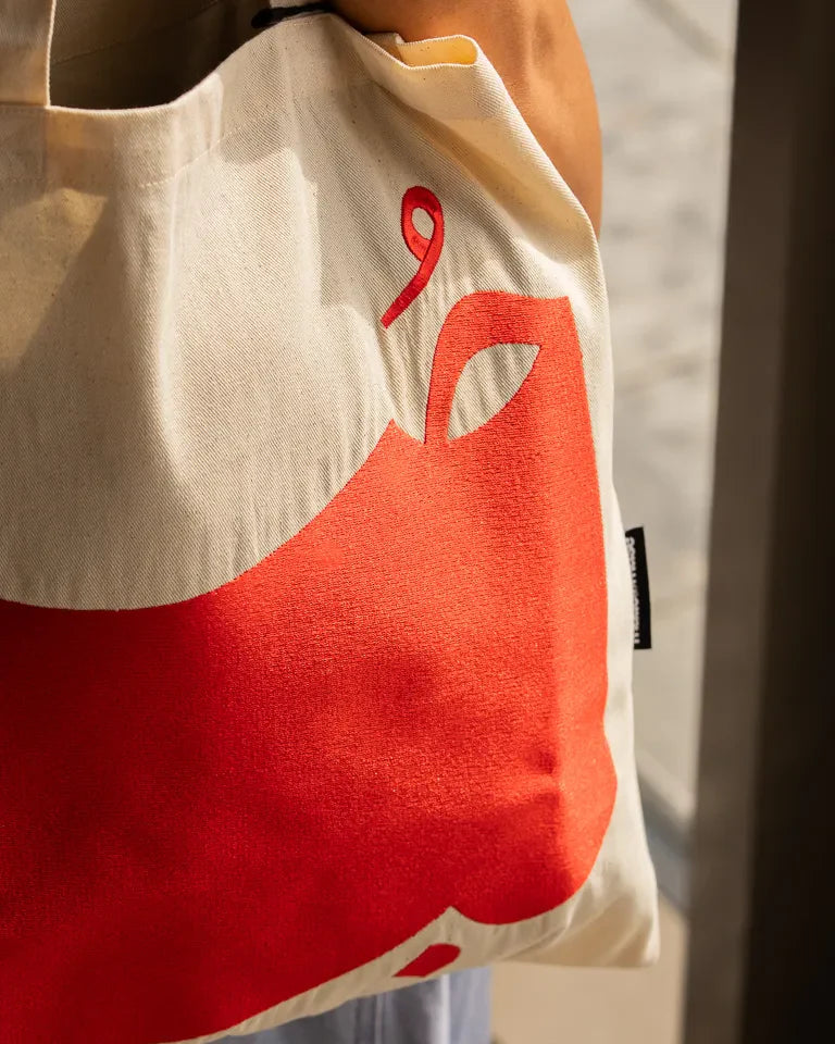 Hob Tote Bag by Ibrahim Zaki — natural canvas tote with embroidered Arabic word Hob in bold typography