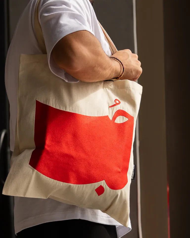Hob Tote Bag by Ibrahim Zaki — natural canvas tote with embroidered Arabic word Hob in bold typography