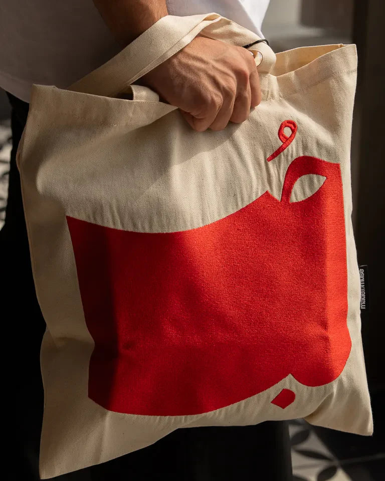 Hob Tote Bag by Ibrahim Zaki — natural canvas tote with embroidered Arabic word Hob in bold typography