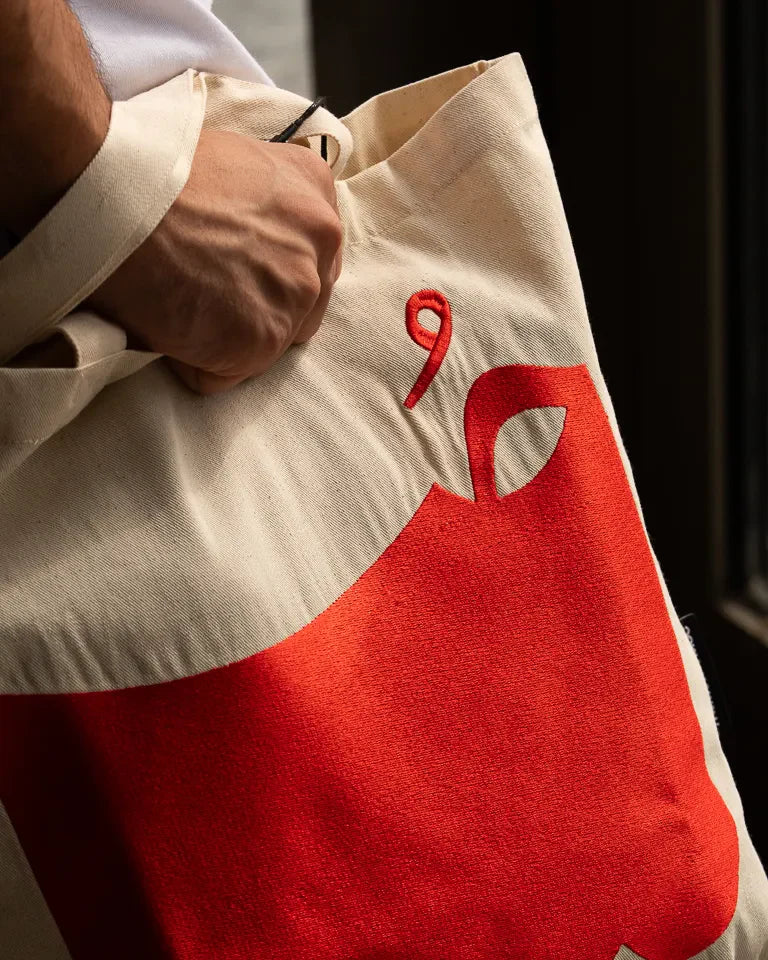 Hob Tote Bag by Ibrahim Zaki — natural canvas tote with embroidered Arabic word Hob in bold typography