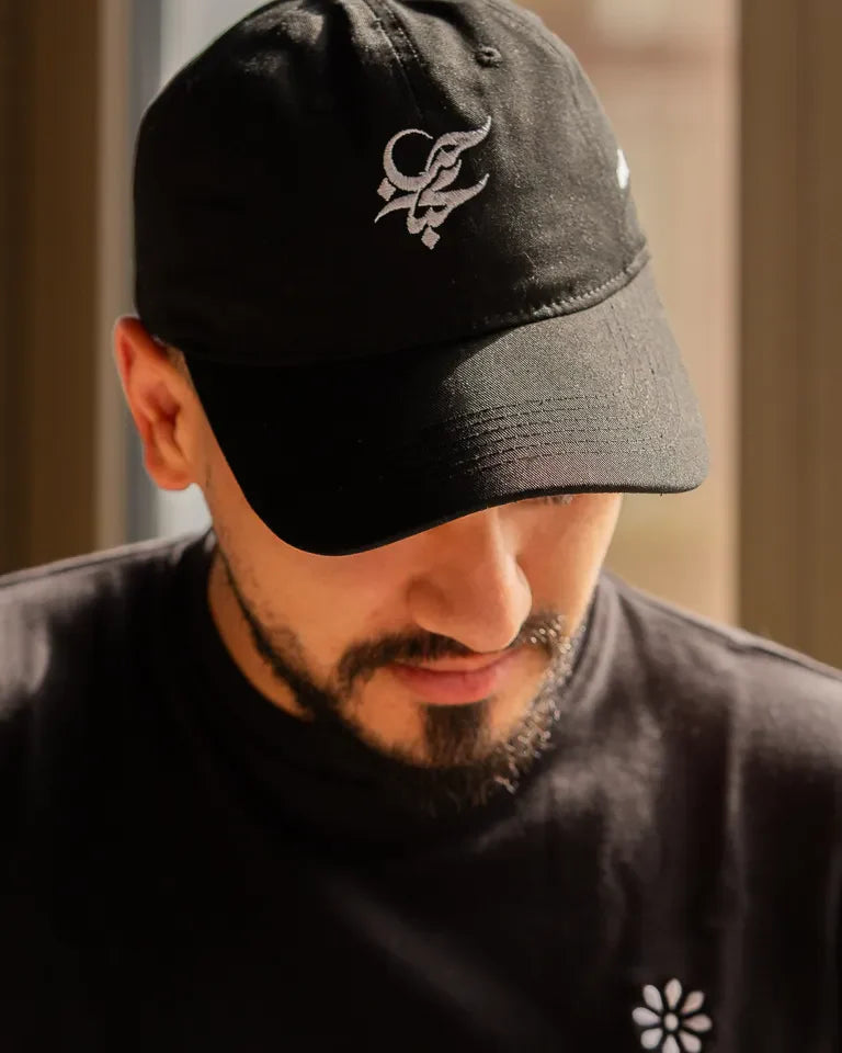 Letters of Love Cap by Wissam Shawkat — embroidered cotton cap with the Arabic word for love in calligraphy