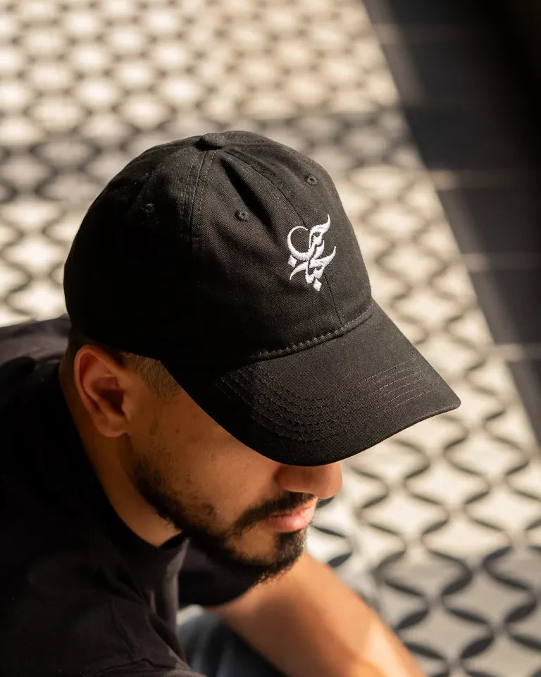 Letters of Love Cap by Wissam Shawkat — embroidered cotton cap with the Arabic word for love in calligraphy