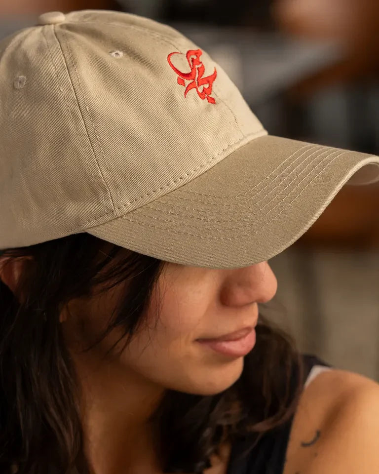 Letters of Love Cap by Wissam Shawkat — embroidered cotton cap with the Arabic word for love in calligraphy