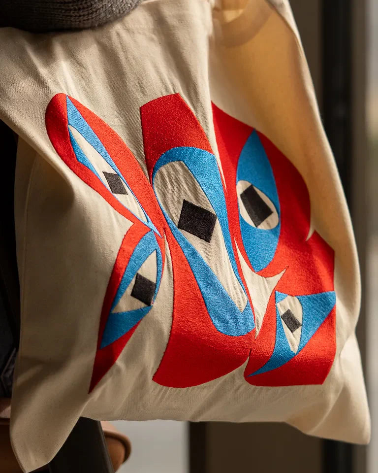 Inside Outside Tote Bag by Wissam Shawkat — natural canvas tote with embroidered bold red and blue Arabic calligraphy