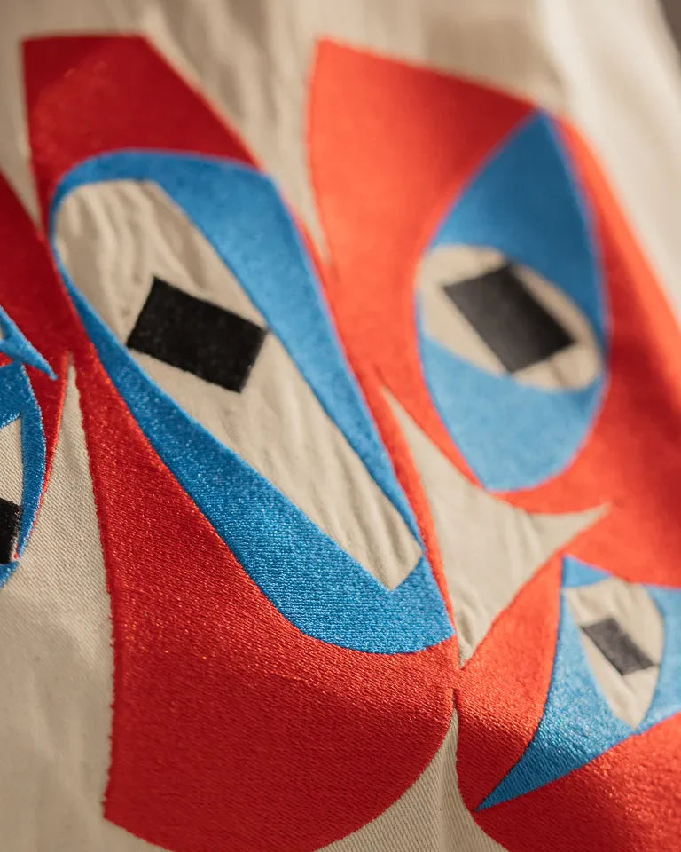 Inside Outside Tote Bag by Wissam Shawkat — natural canvas tote with embroidered bold red and blue Arabic calligraphy