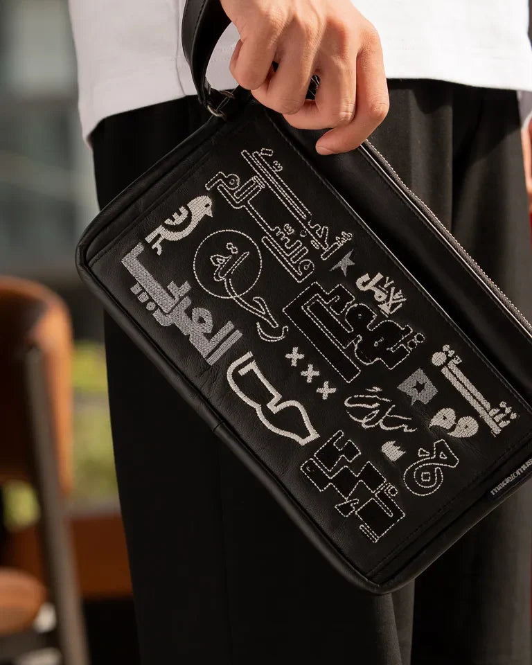 Fragments Leather Pouch by Ibrahim Zaki — handmade calfskin leather pouch with embroidered Arabic calligraphy