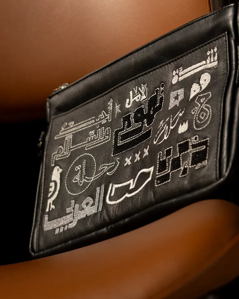 Fragments Leather Pouch by Ibrahim Zaki — handmade calfskin leather pouch with embroidered Arabic calligraphy