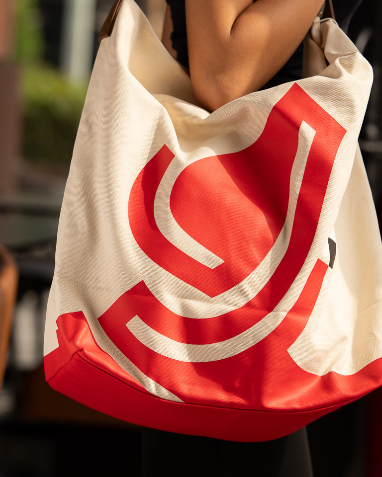 Monumental Handbag, Red by Wissam Shawkat — structured canvas handbag with bold red Arabic calligraphy stroke