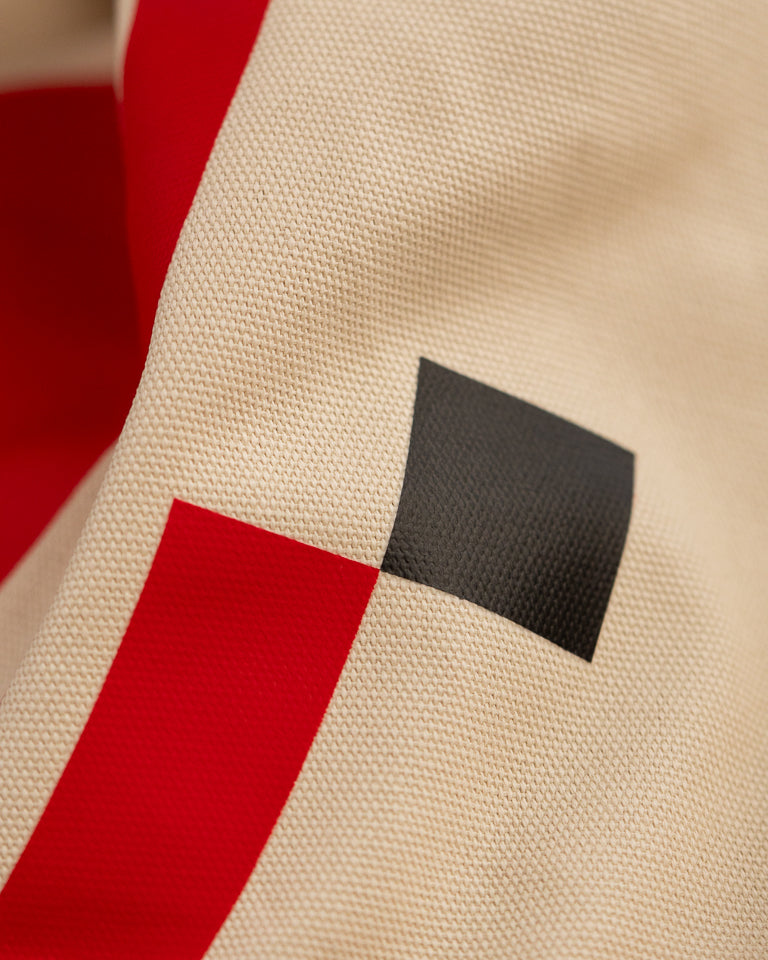 Monumental Handbag, Red by Wissam Shawkat — structured canvas handbag with bold red Arabic calligraphy stroke