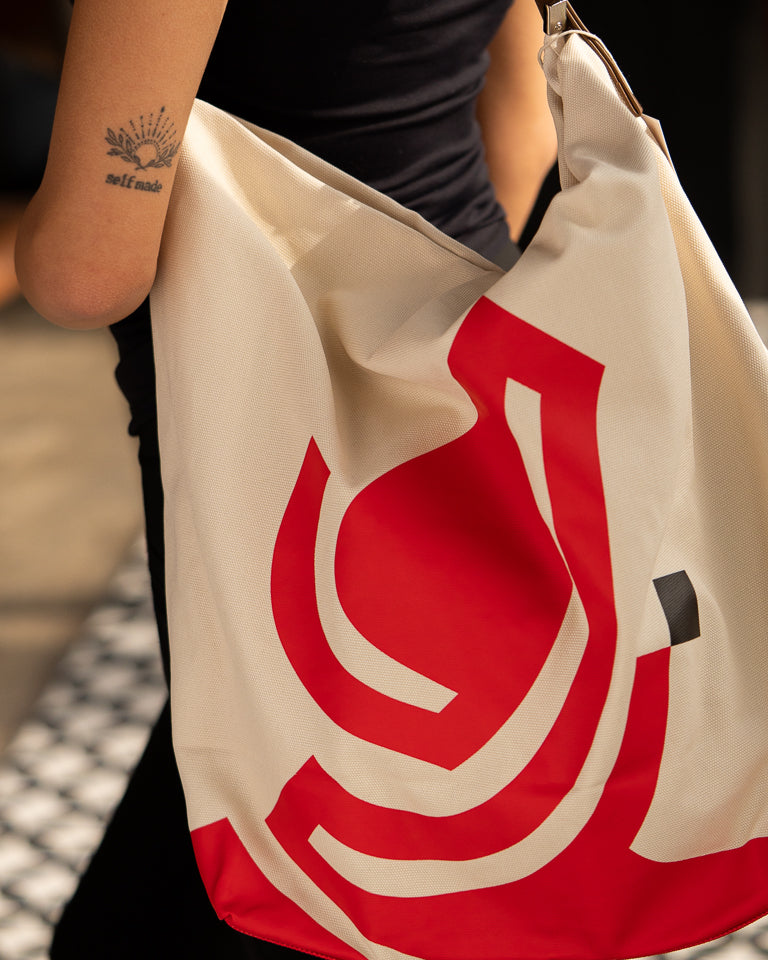 Monumental Handbag, Red by Wissam Shawkat — structured canvas handbag with bold red Arabic calligraphy stroke