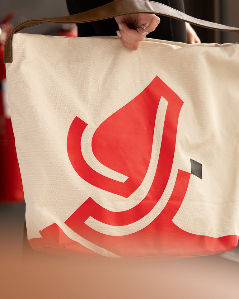 Monumental Handbag, Red by Wissam Shawkat — structured canvas handbag with bold red Arabic calligraphy stroke