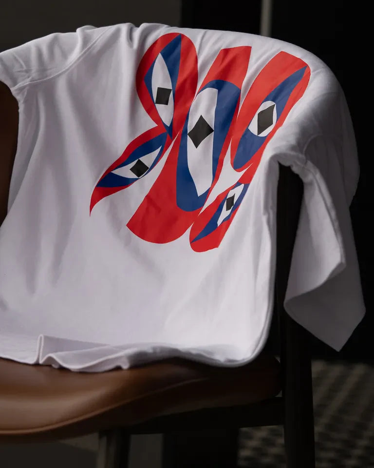 Inside Outside Tee by Wissam Shawkat — white cotton t-shirt with bold red and blue Arabic calligraphy graphic
