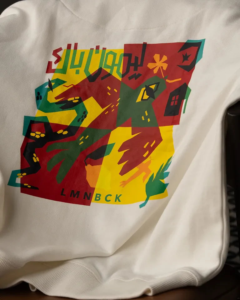 The Return Hoodie by Naji Al-Ali LMNBCK — premium cotton hoodie with bold colourful LMNBCK graphic illustration