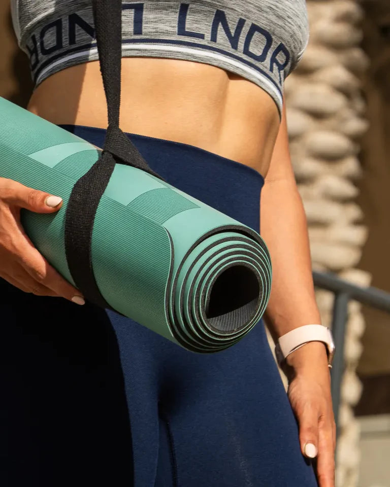 Eternal Yoga Mat by Wissam Shawkat — full-length yoga mat printed with flowing Arabic calligraphy in black and red
