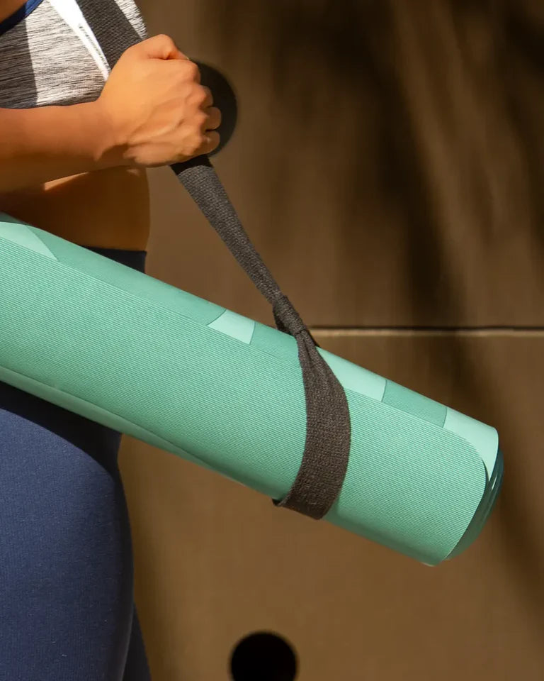 Eternal Yoga Mat by Wissam Shawkat — full-length yoga mat printed with flowing Arabic calligraphy in black and red