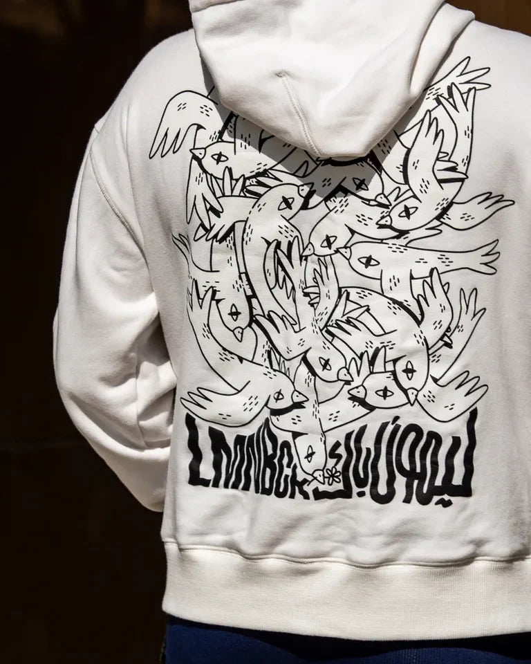 Free Birds Hoodie by Naji Al-Ali LMNBCK — premium cotton hoodie with bold black bird illustration