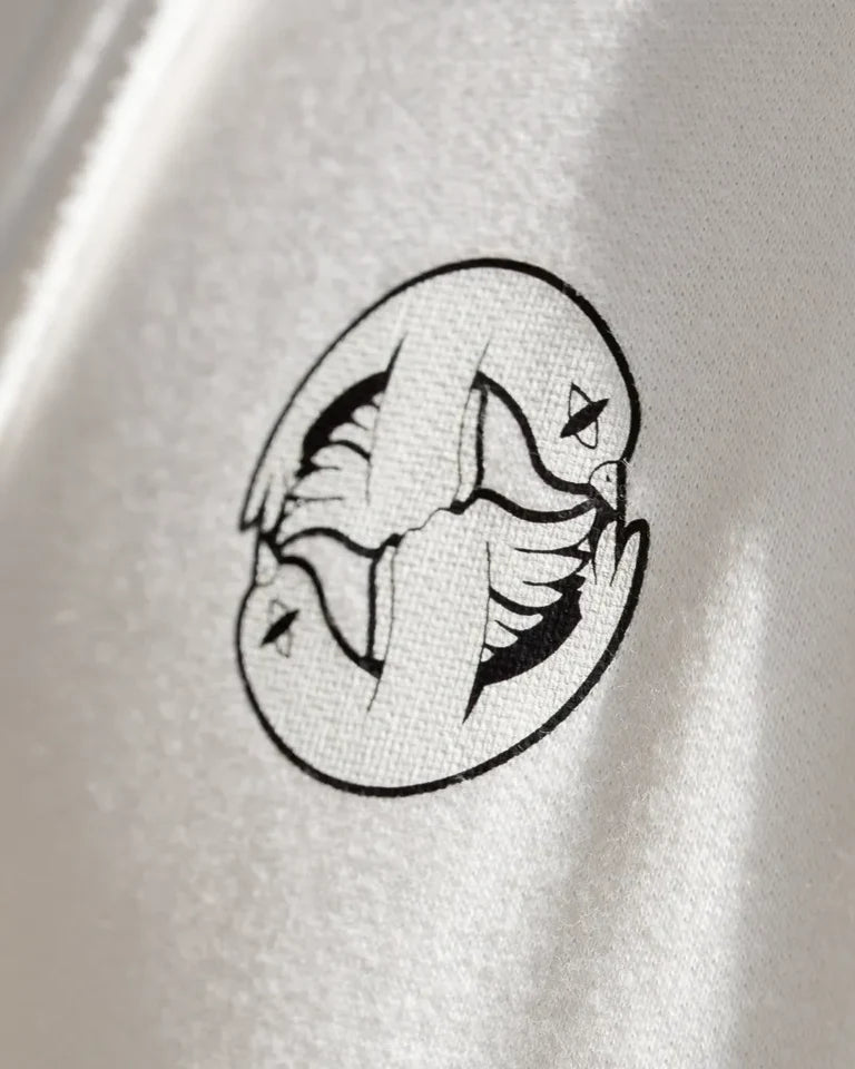 Free Birds Hoodie by Naji Al-Ali LMNBCK — premium cotton hoodie with bold black bird illustration