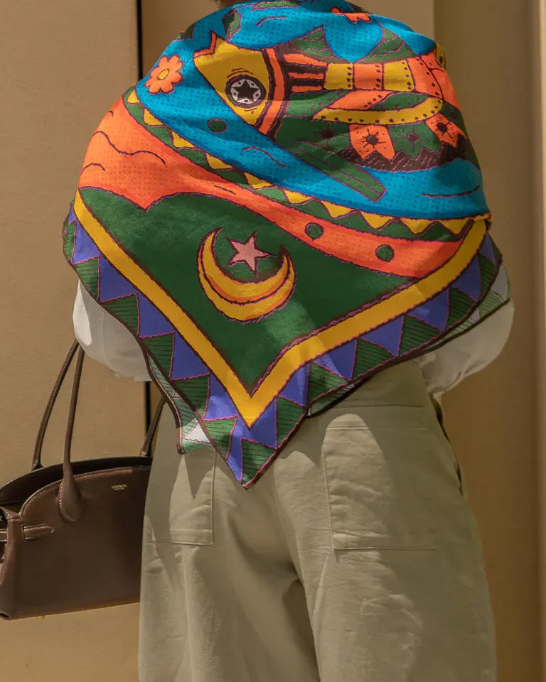 The Fish Silk Shawl by Toka Asal — premium silk scarf with Egyptian Tattoos twin fish illustration in bold colour