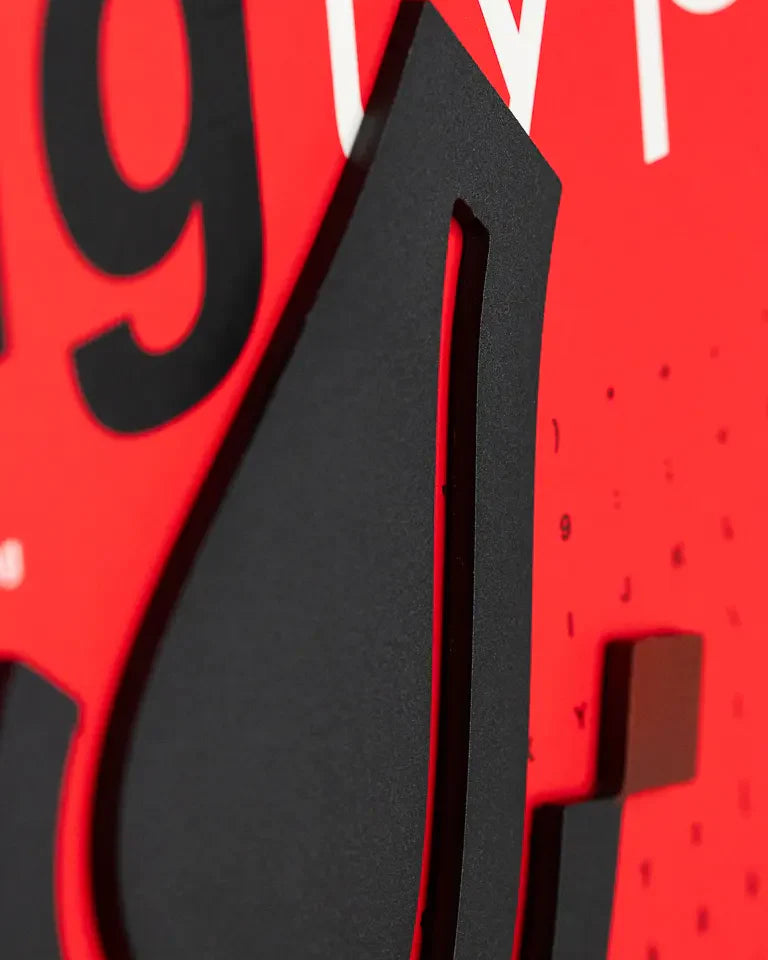 Eternal Bookends by Wissam Shawkat — precision-cut steel bookends with Arabic calligraphy in matte black and red